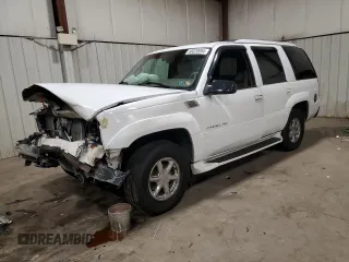 2000 Cadillac Escalade z VIN 1GYEK63R0YR185780, wystawiony jako Copart lot #80620994 z przebiegiem 16 717 mil mil oraz Szkody całkowita. Historia ofert i sprzedaży dostępna na DreamBid. Obrazek 1.