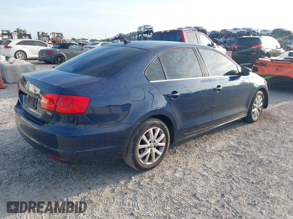2014 Volkswagen Jetta SE with VIN 3VWD07AJ6EM417996, listed as a IAAI auction lot 42723125 with 108,952 mi miles and . Bid and sale history available at DreamBid. Image 4.