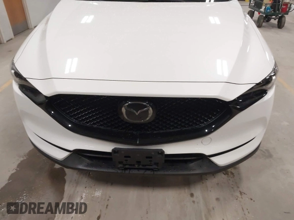 2020 Mazda CX-5 Grand Touring with VIN JM3KFBDM6L1828611, listed as a IAAI auction lot 42006976 with 59,939 mi miles and . Bid and sale history available at DreamBid. Image 13.