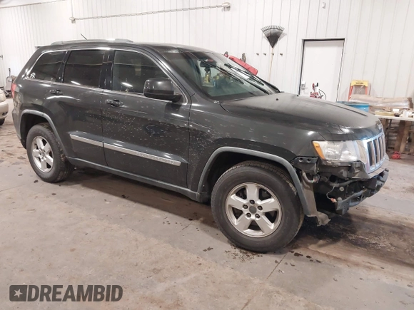 2011 Jeep Grand Cherokee 70th Anniversary with VIN 1J4RR4GG3BC745652, listed as a IAAI auction lot 41133698 with 217,948 mi miles. Bid and sale history available at carsss.com. Image 1.