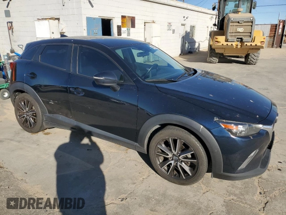 2017 Mazda CX-3 Touring z VIN JM1DKDC74H0165654, wystawiony jako Copart lot #41928295 z przebiegiem 173 567 mil mil oraz Szkoda całkowita • Salvage title. Historia ofert i sprzedaży dostępna na DreamBid. Obrazek 4.