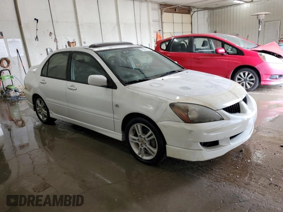 2004 Mitsubishi Lancer with VIN JA3AJ66F64U029144, listed as a Copart auction lot 77437234 with 158,049 mi miles and Salvage Title. Bid and sale history available at DreamBid. Image 4.