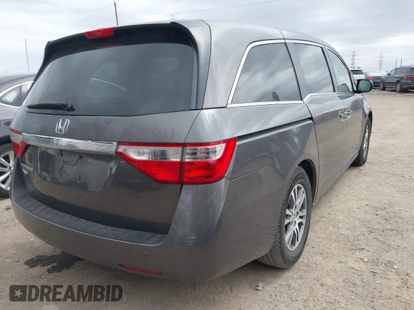 2012 Honda Odyssey EX-L with VIN 5FNRL5H60CB081866, listed as a IAAI auction lot 41835701 with 151,236 mi miles and . Bid and sale history available at DreamBid. Image 4.