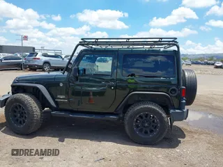 2012 Jeep Wrangler Sahara z VIN 1C4AJWBGXCL100527, wystawiony jako IAAI lot #42394623 z przebiegiem 126 097 mil mil oraz . Historia ofert i sprzedaży dostępna na DreamBid. Obrazek 14.