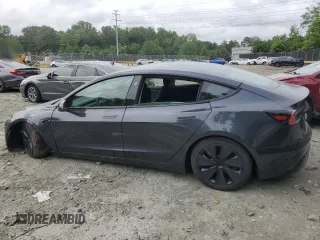 2025 Tesla Model 3 Long Range with VIN 5YJ3E1EAXSF878982, listed as a Copart auction lot 60302315 with 4,312 mi miles and Salvage title. Bid and sale history available at DreamBid. Image 2.