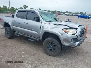 2020 Toyota Tacoma SR5 with VIN 5TFAZ5CN6LX088210, listed as a IAAI auction lot 42428573 with 100,468 mi miles and . Bid and sale history available at DreamBid. Image 1.
