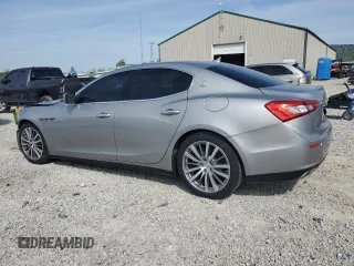 2014 Maserati Ghibli z VIN ZAM57XSA8E1087661, wystawiony jako Copart lot #54215595 z przebiegiem 108 280 mil mil oraz Szkoda całkowita • Salvage title. Historia ofert i sprzedaży dostępna na DreamBid. Obrazek 2.