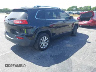 2015 Jeep Cherokee Latitude with VIN 1C4PJLCB4FW683904, listed as a IAAI auction lot 41579059 with 126,156 mi miles and . Bid and sale history available at carsss.com. Image 4.