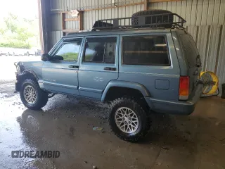 1998 Jeep Cherokee Country with VIN 1J4FT78S8WL252502, listed as a Copart auction lot 59664545 with 133,148 mi miles and Salvage title. Bid and sale history available at DreamBid. Image 2.