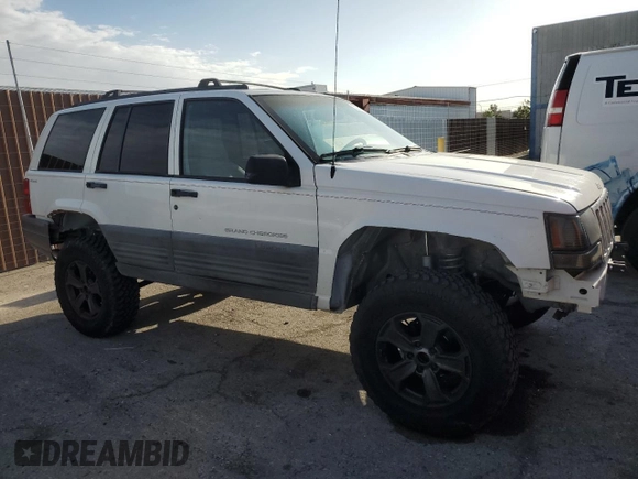 1998 Jeep Grand Cherokee Laredo with VIN 1J4GZ58S6WC319444, listed as a Copart auction lot 53147665 with 217,068 mi miles and Salvage Title. Bid and sale history available at carsss.com. Image 4.
