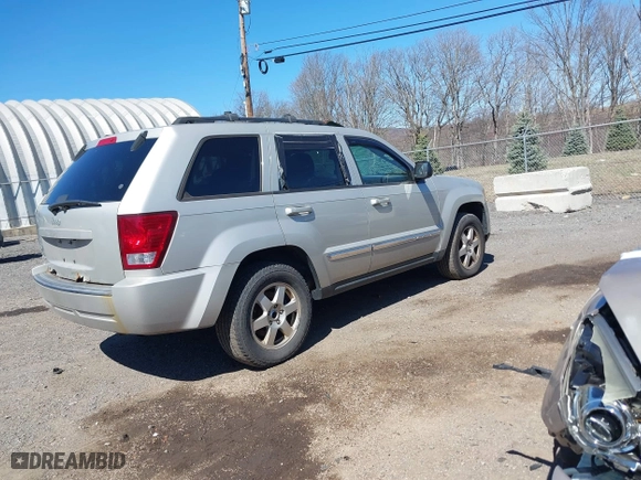 2010 Jeep Grand Cherokee Laredo with VIN 1J4PR4GK2AC125918, listed as a IAAI auction lot 41899078 with 236,229 mi miles. Bid and sale history available at carsss.com. Image 4.