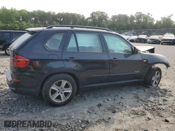 2012 BMW X5 35i with VIN 5UXZV4C5XCL761370, listed as a Copart auction lot 59436845 with 124,722 mi miles and Salvage title. Bid and sale history available at DreamBid. Image 3.