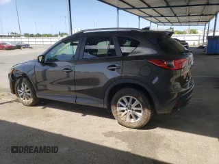 2016 Mazda CX-5 Touring z VIN JM3KE2CY4G0805072, wystawiony jako Copart lot #58435535 z przebiegiem 146 323 mil mil oraz Szkoda całkowita • Salvage title. Historia ofert i sprzedaży dostępna na DreamBid. Obrazek 2.