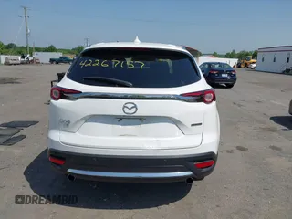 2021 Mazda CX-9 Grand Touring z VIN JM3TCBDY8M0537986, wystawiony jako IAAI lot #42267157 z przebiegiem 25 375 mil mil oraz . Historia ofert i sprzedaży dostępna na DreamBid. Obrazek 17.