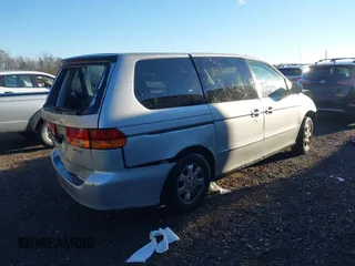 2002 Honda Odyssey EX z VIN 2HKRL18652H566576, wystawiony jako IAAI lot #40974704 z przebiegiem 232 172 mil mil oraz . Historia ofert i sprzedaży dostępna na DreamBid. Obrazek 4.