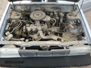1987 Nissan Sentra z VIN JN1PB2210HU557007, wystawiony jako Copart lot #68174784 z przebiegiem 150 316 mil mil oraz Tytuł czysty. Historia ofert i sprzedaży dostępna na DreamBid. Obrazek 11.