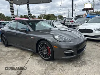 2013 Porsche Panamera Turbo z VIN WP0AC2A77DL090142, wystawiony jako Copart lot #46481195 z przebiegiem 60 560 mil mil oraz Czysty tytuł • Clean title. Historia ofert i sprzedaży dostępna na DreamBid. Obrazek 1.