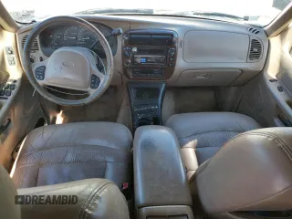 1999 Ford Explorer XLT with VIN 1FMZU34E8XZB27387, listed as a Copart auction lot 74398364 with 211,520 mi miles and Clean title. Bid and sale history available at DreamBid. Image 8.