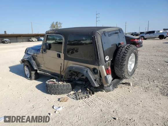 2003 Jeep Wrangler Rubicon with VIN 1J4FA69S73P339925, listed as a Copart auction lot 75341094 with Not provided miles and Salvage title. Bid and sale history available at DreamBid. Image 2.