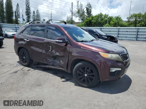 2012 Kia Sorento SX with VIN 5XYKW4A29CG308152, listed as a Copart auction lot 64895355 with 126,816 mi miles and Salvage title. Bid and sale history available at DreamBid. Image 4.