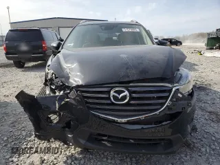 2016 Mazda CX-5 Touring z VIN JM3KE4CY0G0667171, wystawiony jako Copart lot #51579005 z przebiegiem 39 487 mil mil oraz Szkoda całkowita • Salvage title. Historia ofert i sprzedaży dostępna na DreamBid. Obrazek 5.
