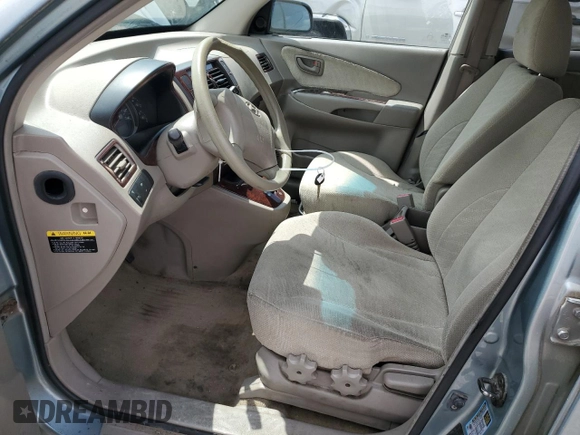 2005 Hyundai Tucson GL with VIN KM8JM12B05U148660, listed as a Copart auction lot 54302805 with 257,233 mi miles and Salvage title. Bid and sale history available at DreamBid. Image 7.