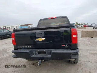 2017 Chevrolet Silverado 1500 LT with VIN 1GCUKREC2HF208232, listed as a IAAI auction lot 40933445 with 105,928 mi miles and . Bid and sale history available at DreamBid. Image 16.