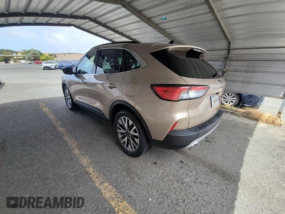 2020 Ford Escape Titanium Hybrid with VIN 1FMCU0DZ5LUB81972, listed as a IAAI auction lot 42679188 with 19,400 mi miles and . Bid and sale history available at DreamBid. Image 13.