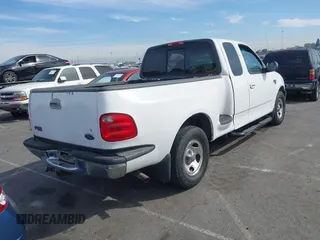 2001 Ford F-150 XL with VIN 1FTRX07L91KA77460, listed as a IAAI auction lot 41686519 with 185,286 mi miles. Bid and sale history available at carsss.com. Image 4.