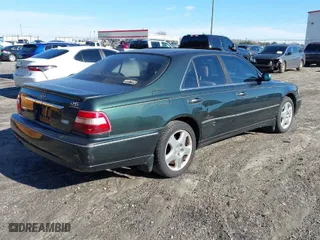 2000 Infiniti Q45 with VIN JNKBY31A7YM301457, listed as a IAAI auction lot 41583825 with 174,265 mi miles. Bid and sale history available at carsss.com. Image 4.