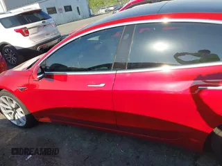 2018 Tesla Model 3 Long Range Battery with VIN 5YJ3E1EA5JF063555, listed as a IAAI auction lot 42028785 with 45,346 mi miles and . Bid and sale history available at DreamBid. Image 14.