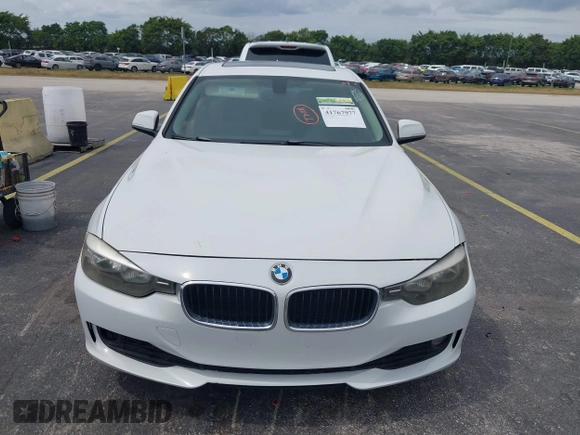 2013 BMW 3 Series 328i with VIN WBA3A5G51DNP26142, listed as a IAAI auction lot 41767977 with 129,440 mi miles. Bid and sale history available at carsss.com. Image 6.