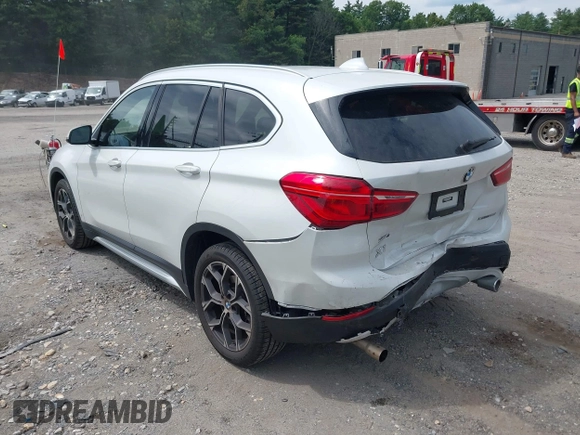 2021 BMW X1 xDrive28i with VIN WBXJG9C07M5U21337, listed as a IAAI auction lot 42590859 with 35,934 mi miles and . Bid and sale history available at DreamBid. Image 3.