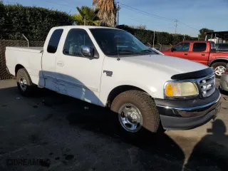 2003 Ford F-150 Work Series with VIN 2FTRX17WX3CA63767, listed as a Copart auction lot 84299684 with 165,719 mi miles and Salvage Title. Bid and sale history available at carsss.com. Image 4.