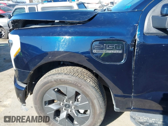 2022 Ford F-150 Lightning Pro z VIN 1FT6W1EV8NWG04113, wystawiony jako IAAI lot #41765532 z przebiegiem 48 990 mil mil oraz . Historia ofert i sprzedaży dostępna na DreamBid. Obrazek 22.