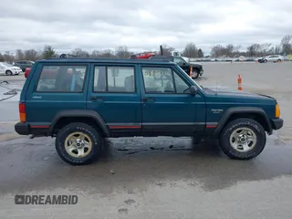 1996 Jeep Cherokee Sport with VIN 1J4FJ68S5TL235507, listed as a IAAI auction lot 41834736 with 174,634 mi miles. Bid and sale history available at carsss.com. Image 13.