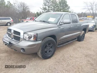 2005 Dodge Dakota SLT with VIN 1D7HE48N05S293699, listed as a IAAI auction lot 41541498 with 166,159 mi miles and . Bid and sale history available at carsss.com. Image 2.