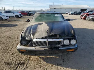 1998 Jaguar XJ with VIN SAJHX1245WC819762, listed as a Copart auction lot 81480174 with 132,491 mi miles and Salvage title. Bid and sale history available at DreamBid. Image 5.