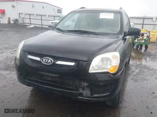 2009 Kia Sportage LX with VIN KNDJE723497612745, listed as a IAAI auction lot 41974301 with 141,110 mi miles. Bid and sale history available at carsss.com. Image 6.