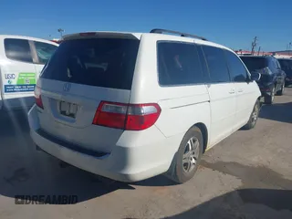 2006 Honda Odyssey EX with VIN 5FNRL38426B400952, listed as a IAAI auction lot 41346853 with 210,826 mi miles and . Bid and sale history available at DreamBid. Image 4.