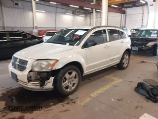 2009 Dodge Caliber SXT with VIN 1B3HB48A89D116734, listed as a IAAI auction lot 41959281 with 209,136 mi miles and . Bid and sale history available at DreamBid. Image 2.