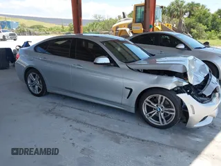 2015 BMW 4 Series 428i with VIN WBA4A5C58FD410076, listed as a IAAI auction lot 39384271 with 125,987 mi miles and . Bid and sale history available at carsss.com. Image 1.