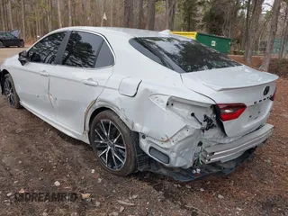 2023 Toyota Camry SE with VIN 4T1G11AKXPU083663, listed as a IAAI auction lot 41245913 with 82,243 mi miles. Bid and sale history available at carsss.com. Image 3.