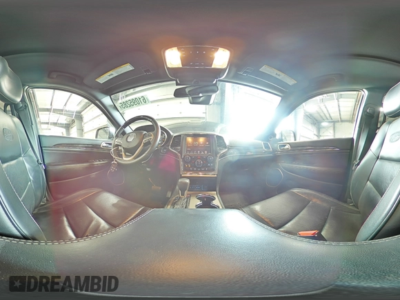 2016 Jeep Grand Cherokee Overland with VIN 1C4RJFCG9GC345309, listed as a Copart auction lot 61095285 with 115,968 mi miles and Salvage title. Bid and sale history available at DreamBid. Image 16.
