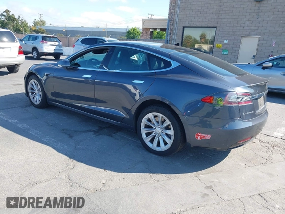 2018 Tesla Model S 75D with VIN 5YJSA1E26JF249573, listed as a IAAI auction lot 42748801 with 88,467 mi miles and . Bid and sale history available at DreamBid. Image 3.