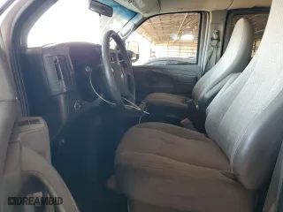 2014 Chevrolet Express Passenger LT with VIN 1GAZG1FG9E1189092, listed as a Copart auction lot 61998064 with 112,743 mi miles and Salvage Title. Bid and sale history available at carsss.com. Image 7.