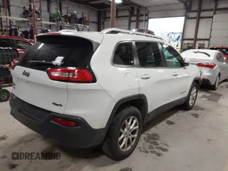 2015 Jeep Cherokee Latitude z VIN 1C4PJMCB4FW635406, wystawiony jako IAAI lot #41168412 z przebiegiem 131 089 mil mil oraz . Historia ofert i sprzedaży dostępna na DreamBid. Obrazek 4.
