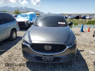 2018 Mazda CX-5 Touring z VIN JM3KFACM5J0338126, wystawiony jako Copart lot #56185795 z przebiegiem 115 254 mil mil oraz Szkoda całkowita • Salvage title. Historia ofert i sprzedaży dostępna na DreamBid. Obrazek 5.