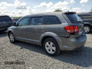 2013 Dodge Journey American Value with VIN 3C4PDCAB8DT566999, listed as a Copart auction lot 61361315 with 183,897 mi miles and Salvage title. Bid and sale history available at DreamBid. Image 2.