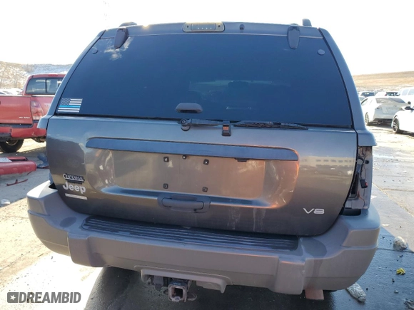 1999 Jeep Grand Cherokee Laredo with VIN 1J4GW58N9XC633464, listed as a Copart auction lot 84682454 with 212,738 mi miles and Salvage Title. Bid and sale history available at carsss.com. Image 6.